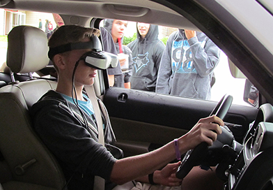 students-watch-driving-simulator