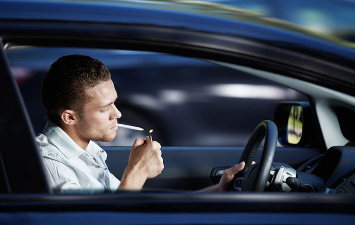drugged-driving-man-smoking-marijuana